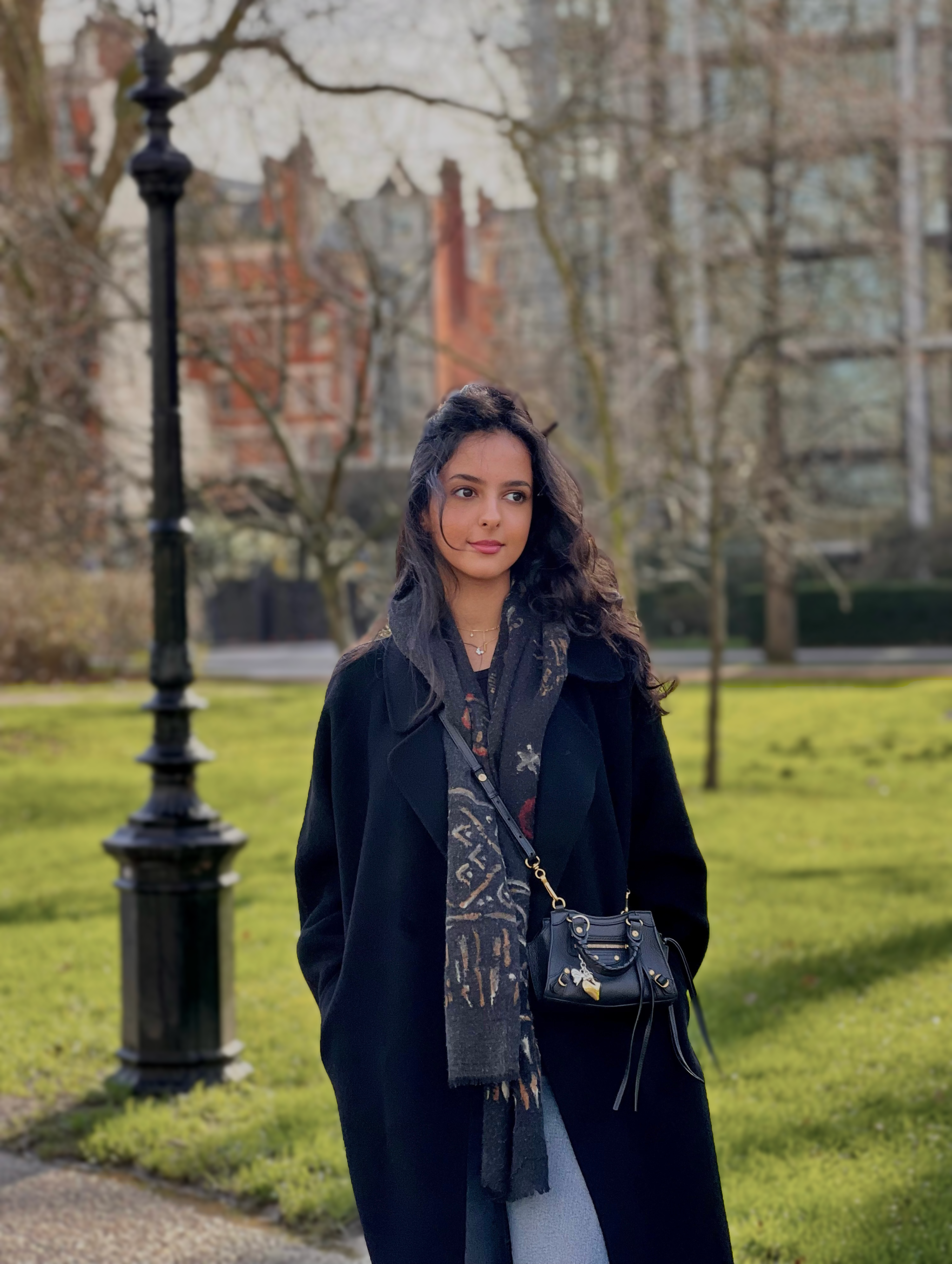 Portrait of Dina Alkhateeb. She is wearing a winter coat