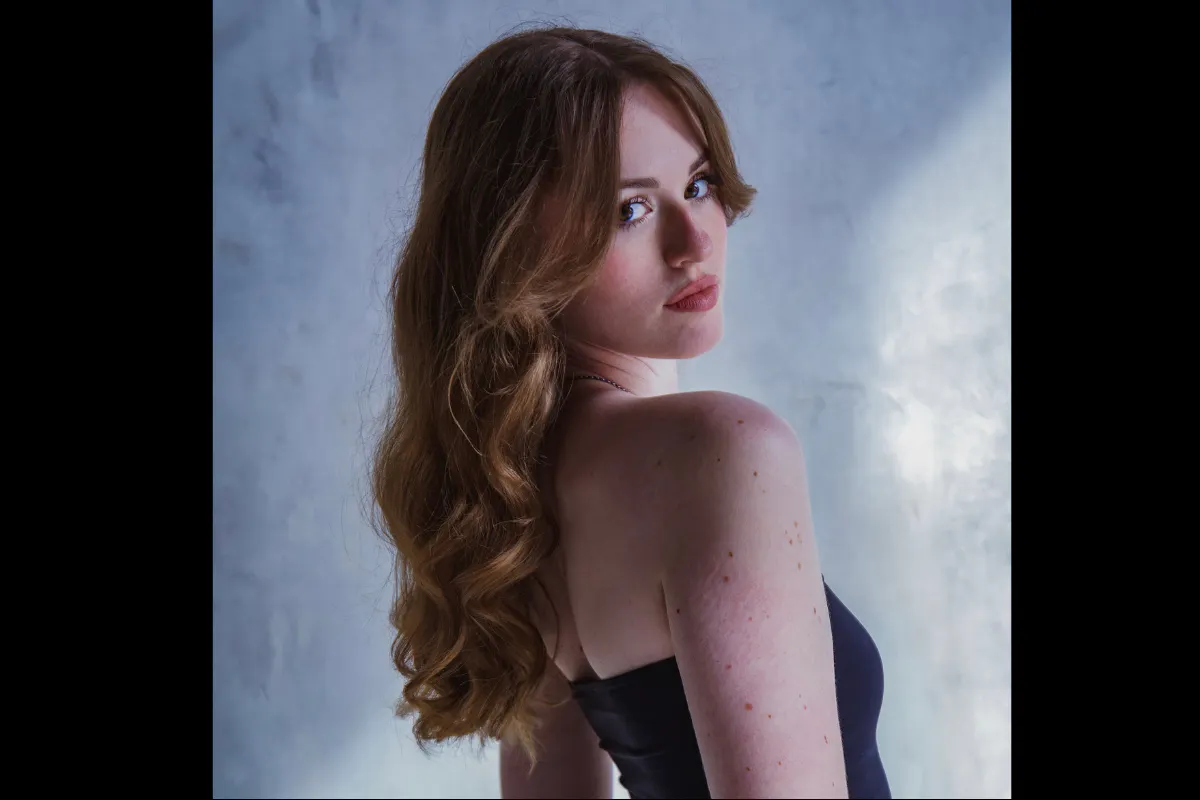 Portrait of Katie James, she is wearing a black dress
