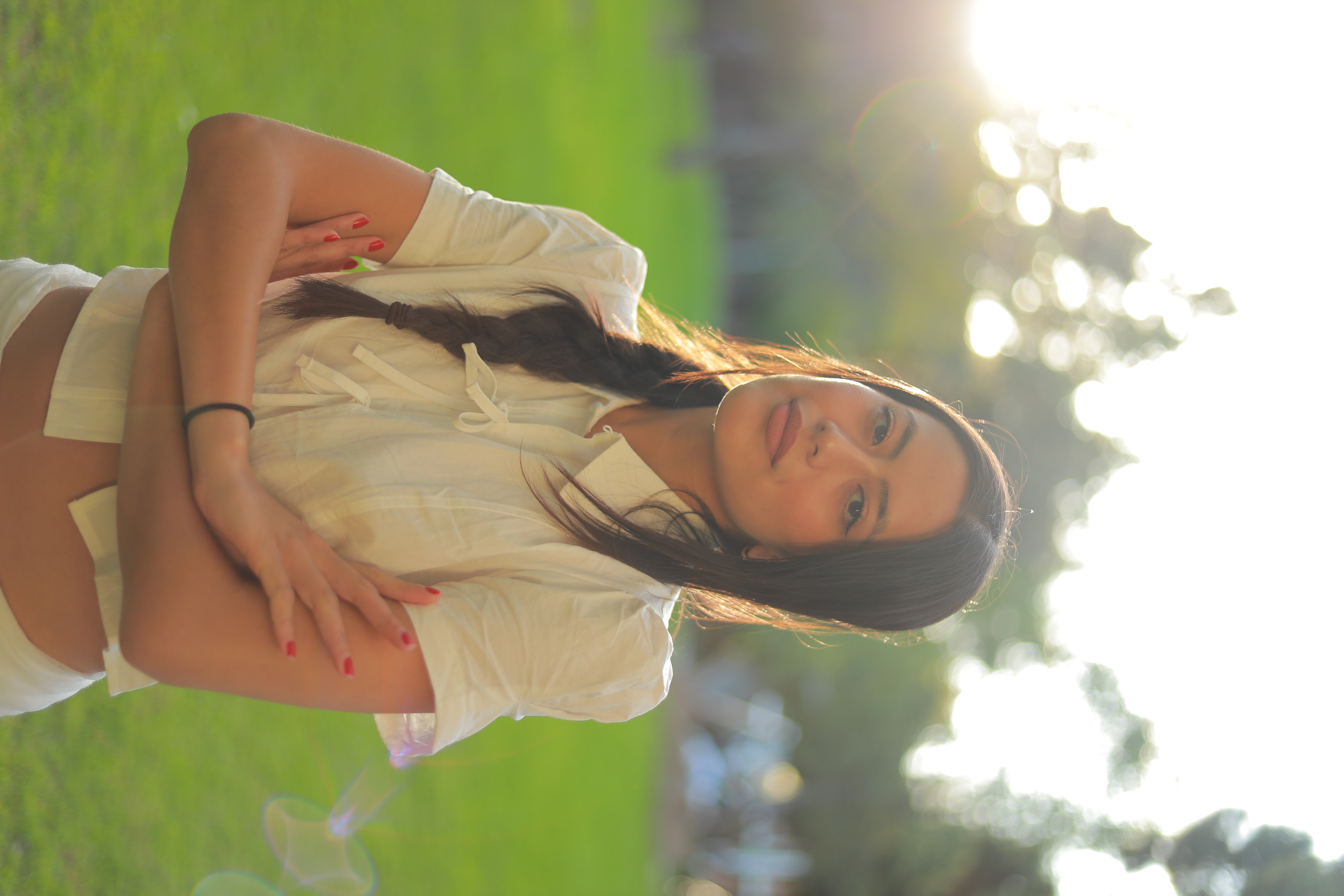 Portrait of Maia Driz-Diaz, she is outside in a sunny space