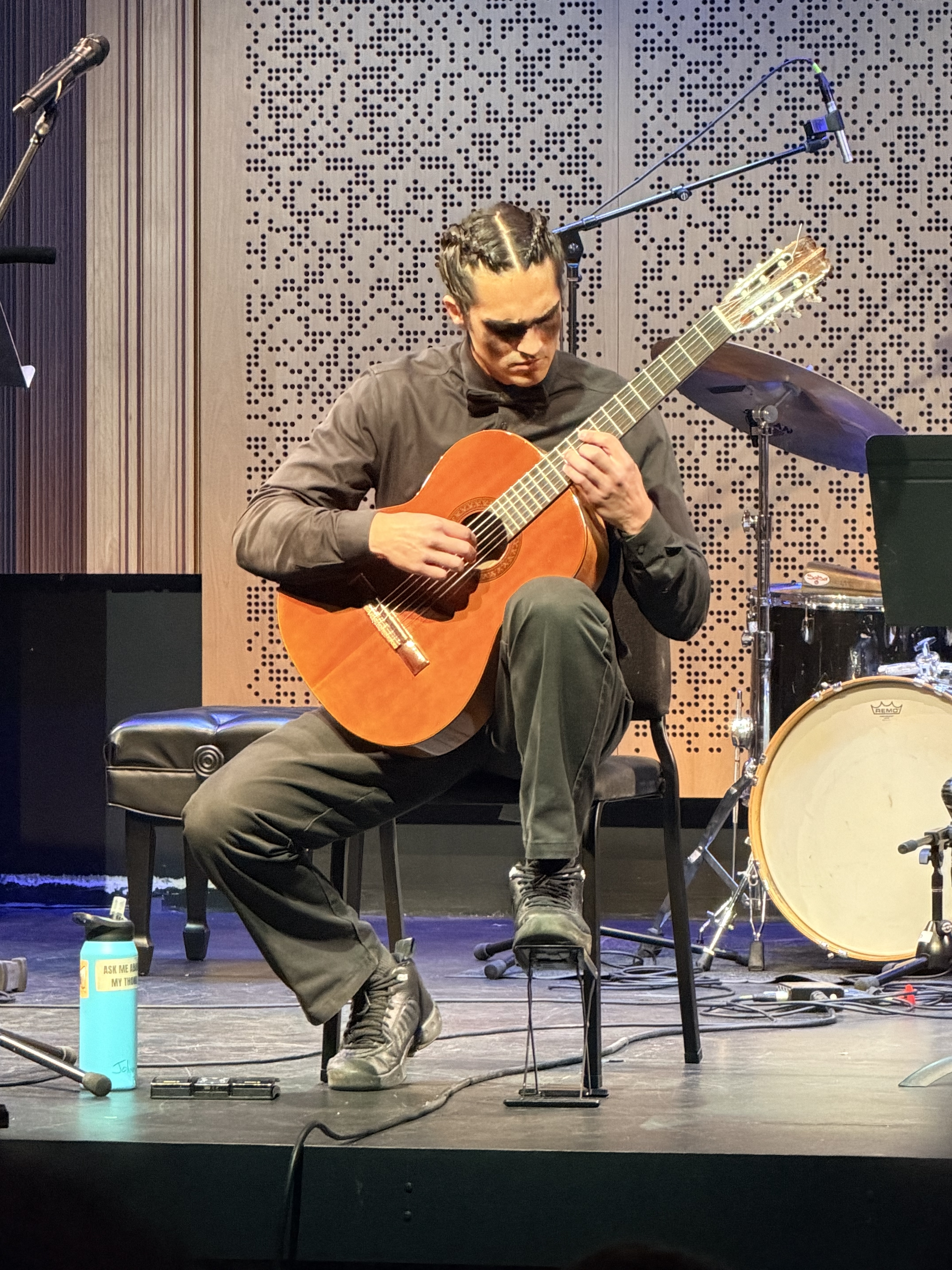 A guitar performer solo on stage