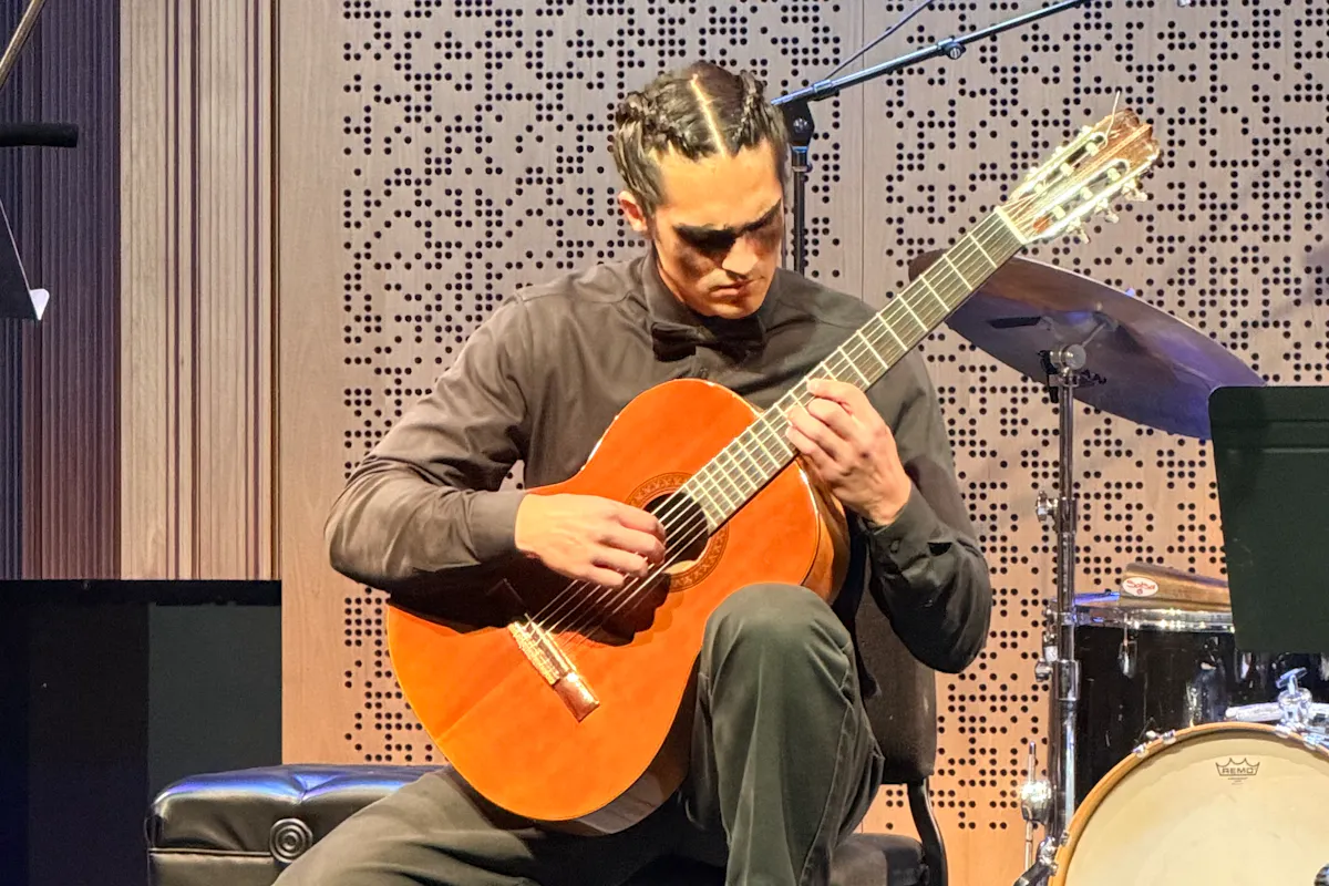 A guitar performer solo on stage