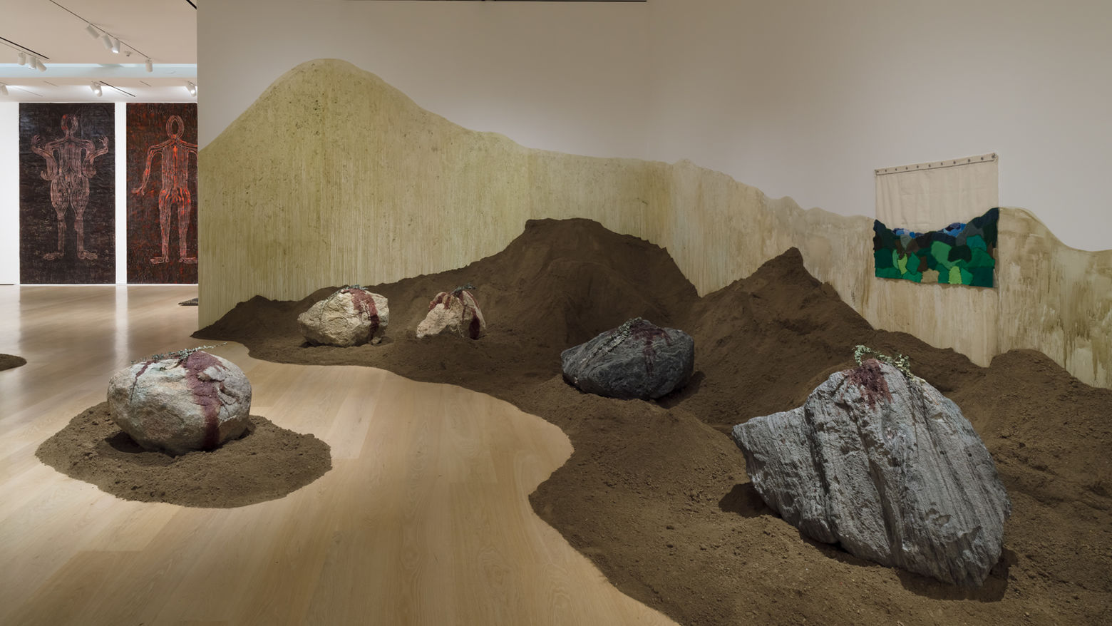 unique artwork in hammer gallery made from large stones and heaps of soil