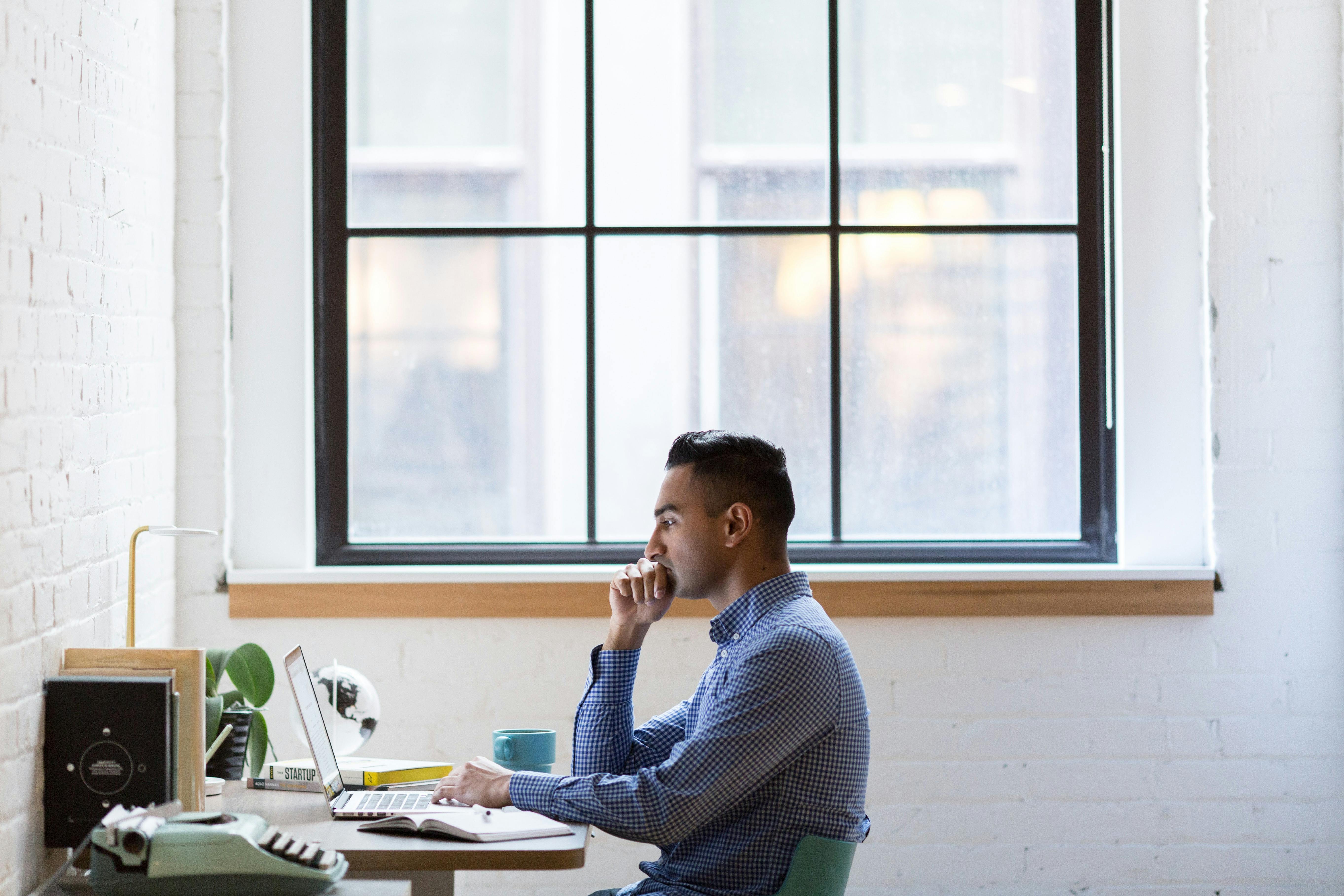 Man sitting at an ergonomically set up office desk