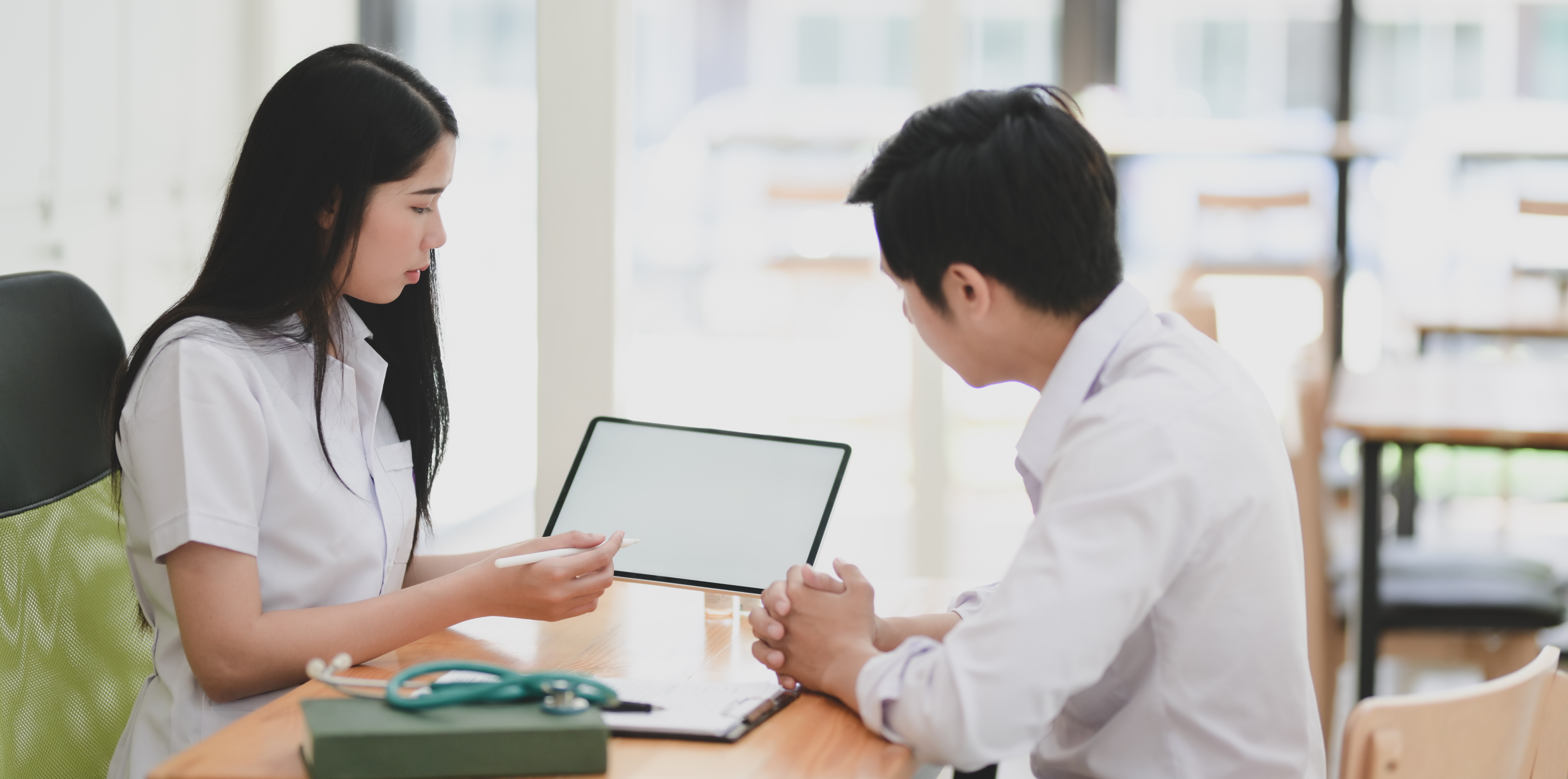 Two work colleagues looking at a tablet