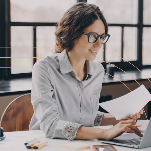 Woman working on her laptop and smiling