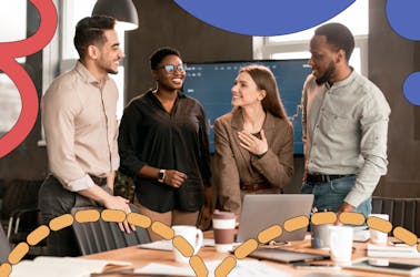 Group of people in a meeting room conversing