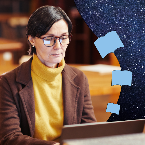 Woman with glasses sitting at a desk in front of a laptop