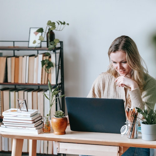 Woman working from home, represent remote employee engagement