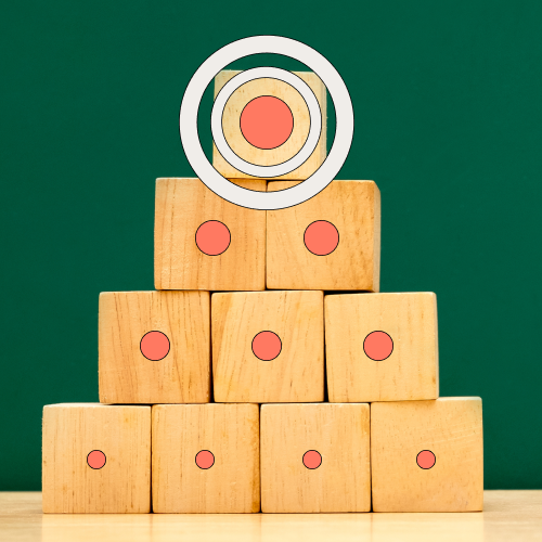 wooden blocks stacked on top of each other in a pyramid