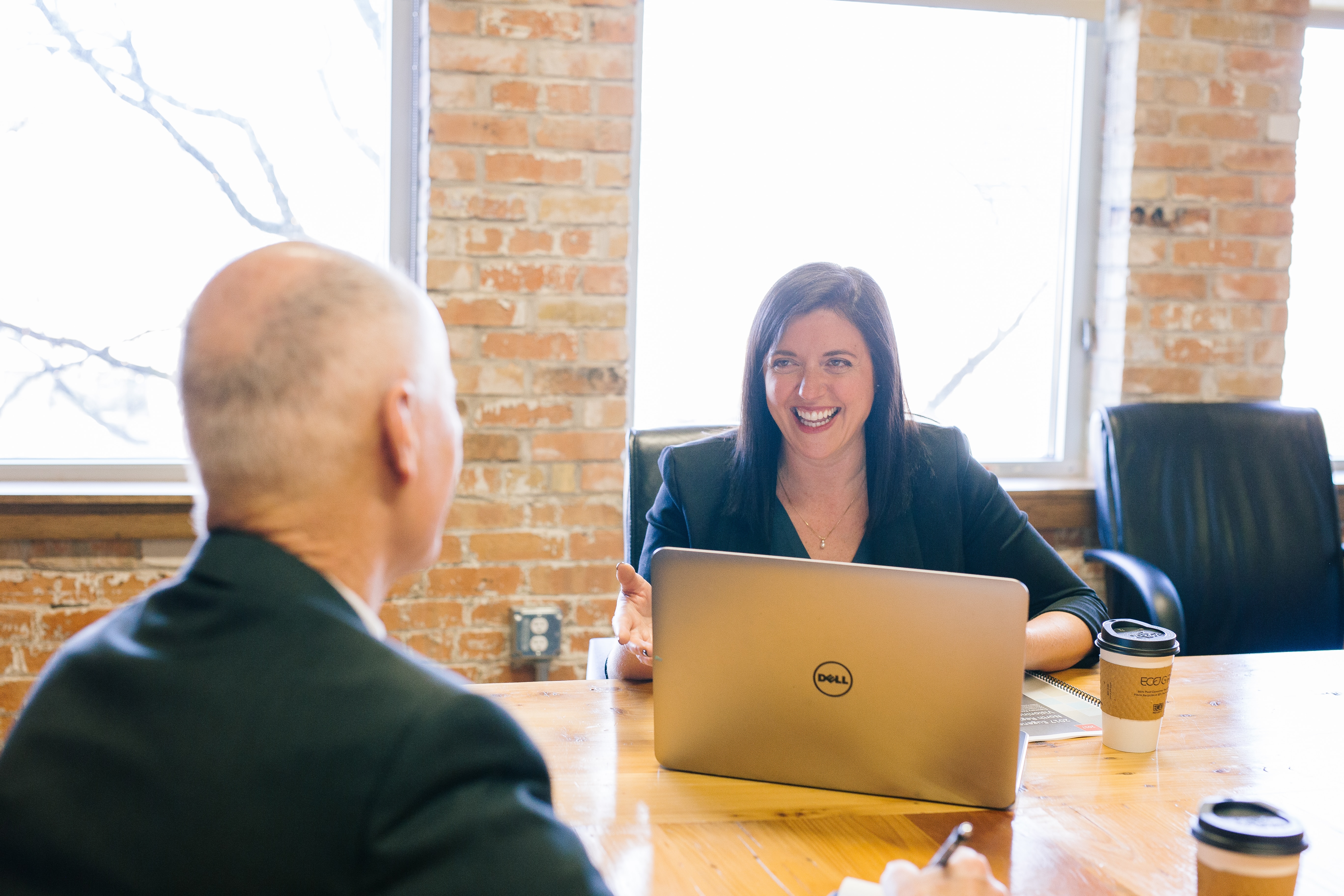 Two people in a meeting at work