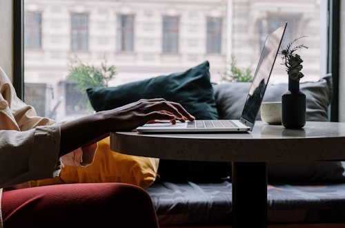 Woman typing on a laptop