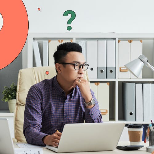 Worker sitting at desk with question mark graphics