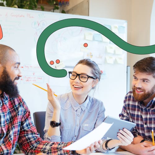 Three people at a desk chatting