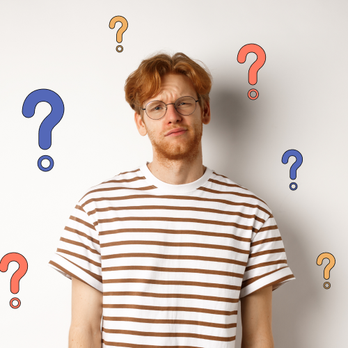 Man standing with his back against a wall looking puzzled