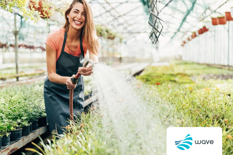 Woman watering plants with a Wave Utilities logo in the corner