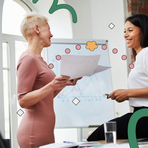 Two women interacting in the office