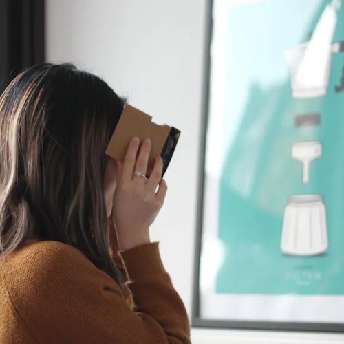 Woman taking a picture with her smartphone to symbolise developing skills for the future