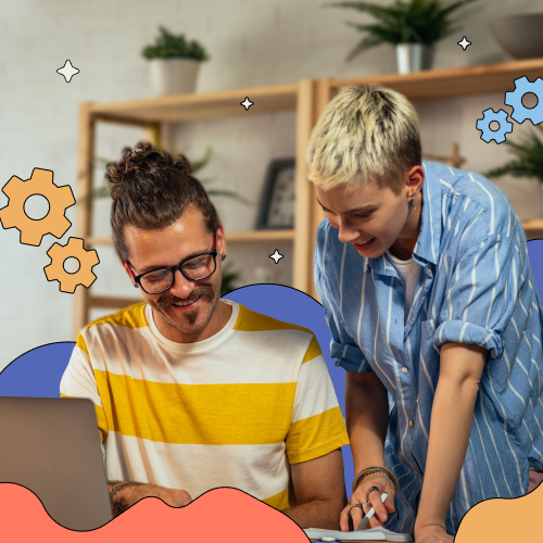 Two people working on a laptop in an office, representing productivity