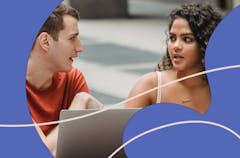 Two young people working together on a laptop