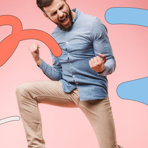Man in office attire celebrating