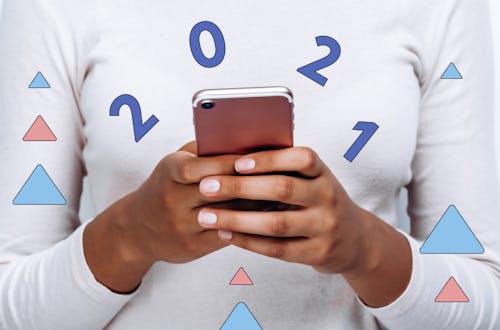 Person holding phone with text 2021 and colourful fun graphics