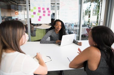 Leader speaking to her team in the office