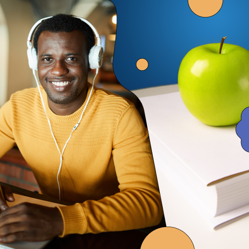 Man sitting at desk with headphones on smiling