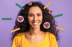 Smiling woman in a yellow shirt with heart imagery around her face