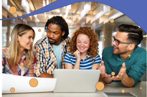 Group of employees chatting around a laptop