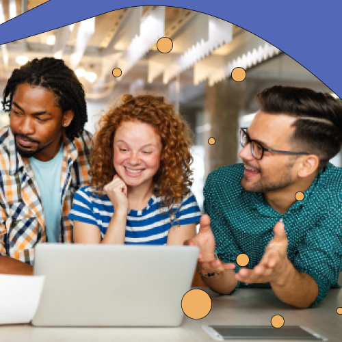 Group of employees chatting around a laptop