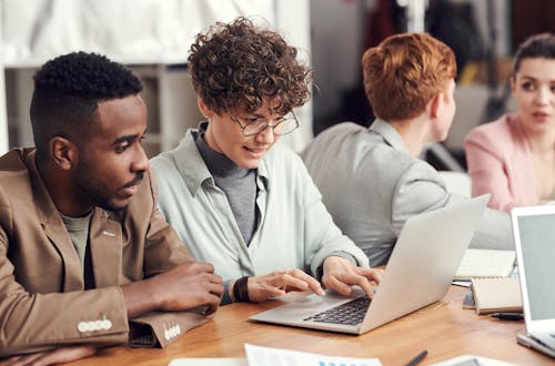 Man and woman looking at laptop