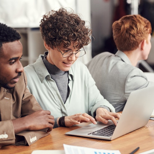 Man and woman looking at laptop