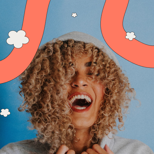 Head shot of woman with curly hair smiling