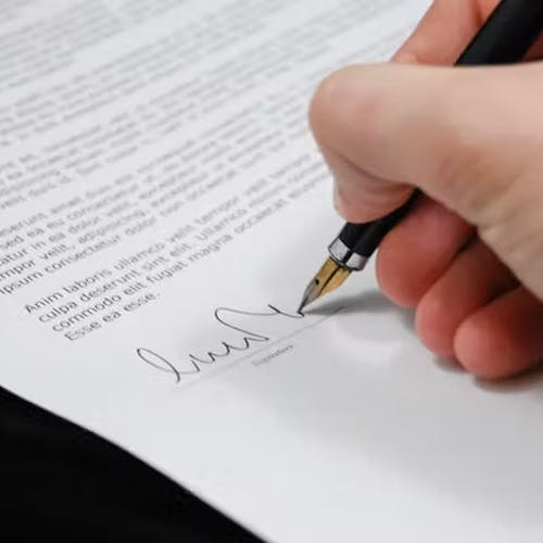 Person signing an employment contract