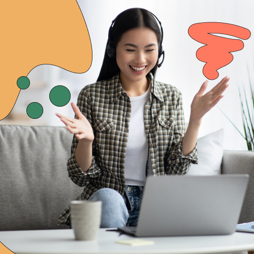 Smiling woman in front of laptop, presumedly on a video call