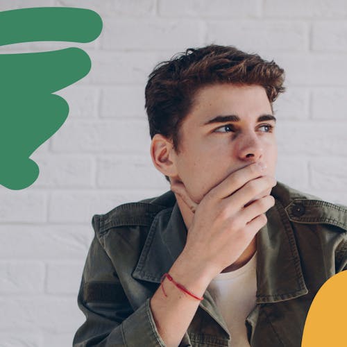 Man staring contemplatively into the distance with his hand on his face