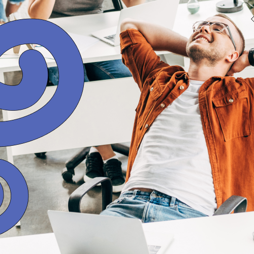 Worker leans back happily at his desk