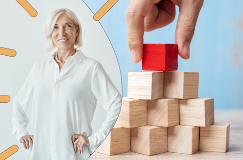 Woman standing with her hands on her hips, next to a pyramid with a red cube on top, representing self-leadership