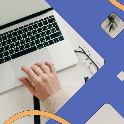 Colourful image of worker at desk using laptop