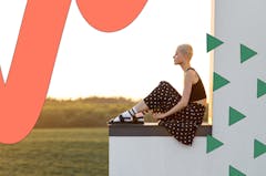 Woman sitting admiring landscape view
