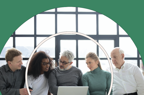 A group of people working on a project in an office with a green background