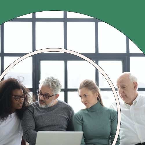 A group of people working on a project in an office with a green background