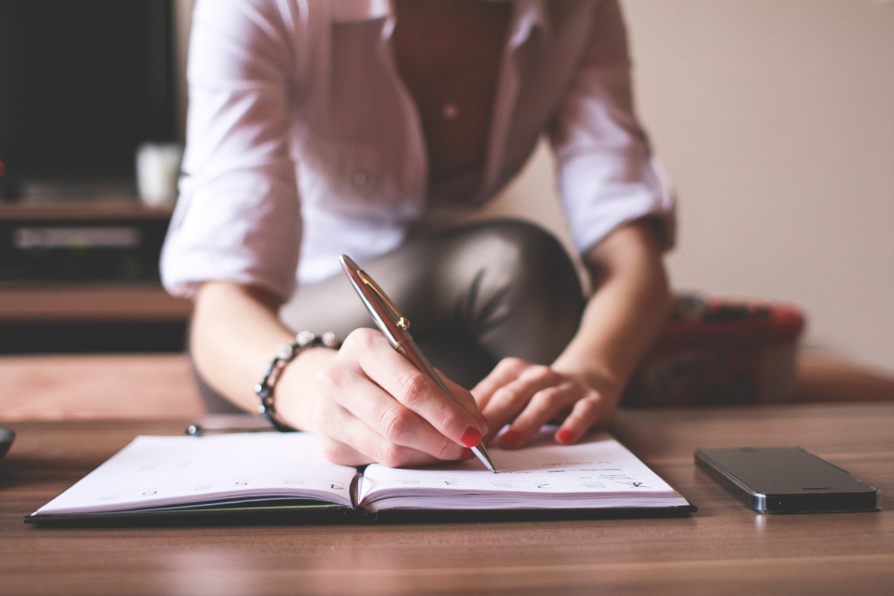 Woman writing in a notebook