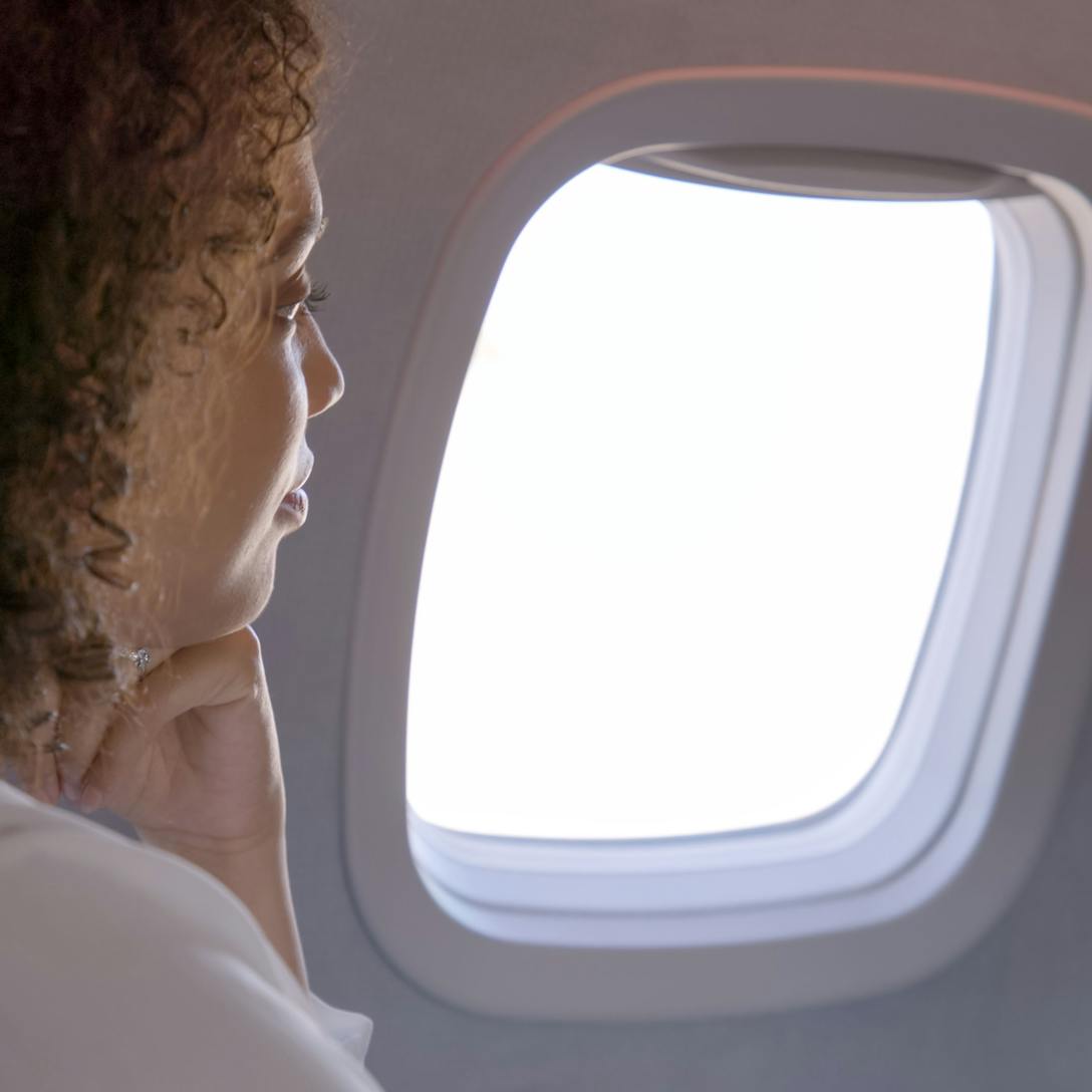 woman looking out of window