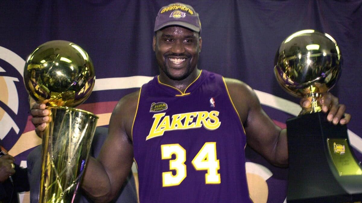 Shaq with his Championship and Finals MVP trophy
