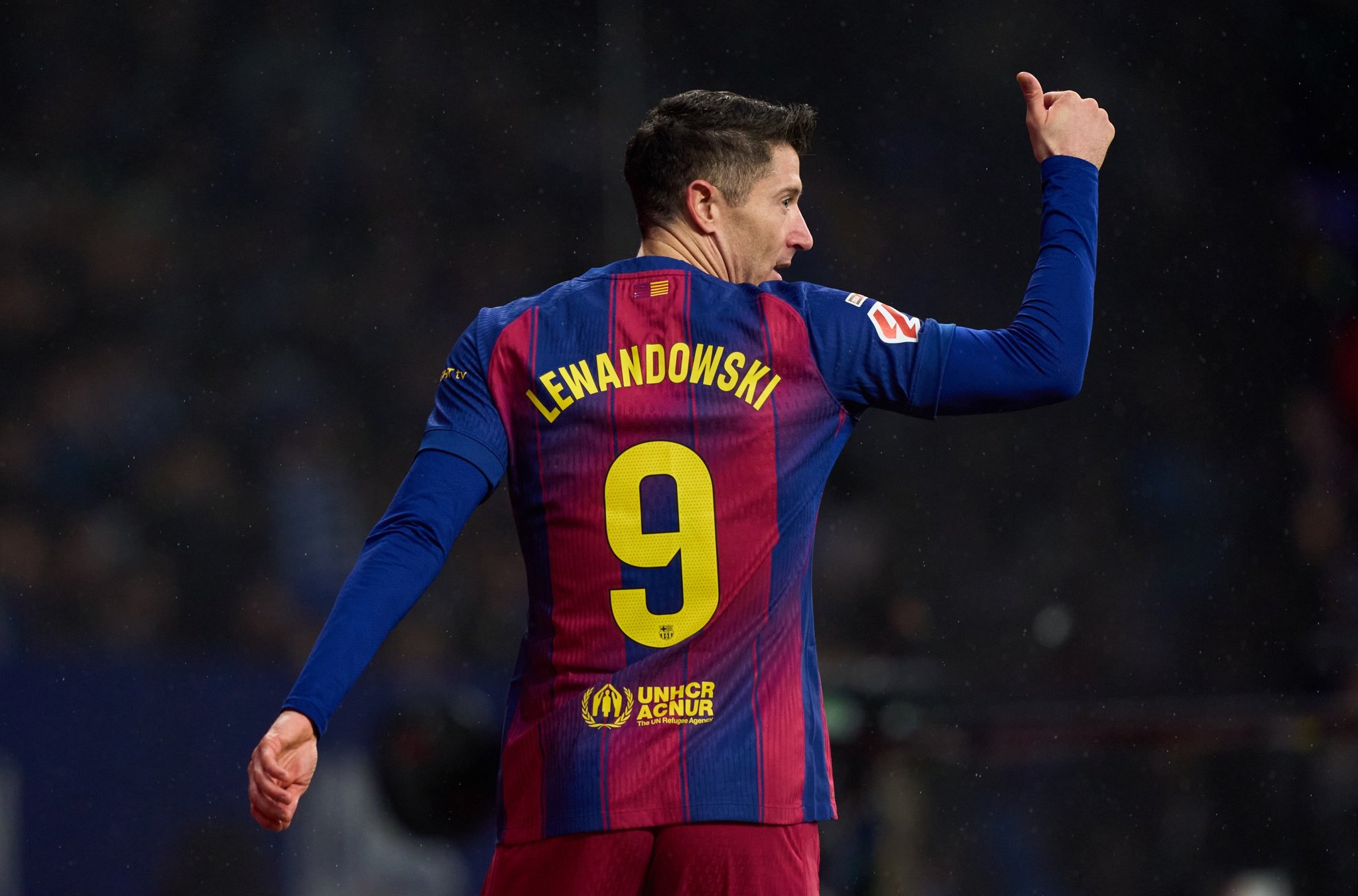 Robert Lewandowski wearing the number 9 Barcelona jersey