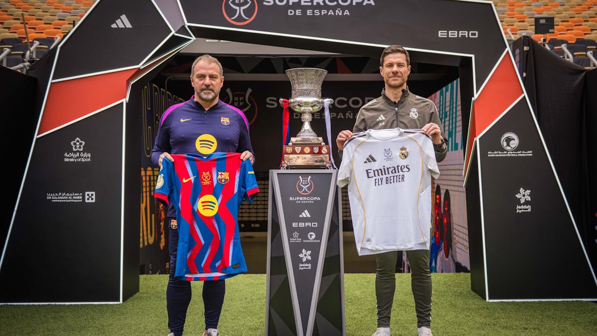 Hansi Flick and Xabi Alonso present jerseys ahead of Spanish Super Cup final.
