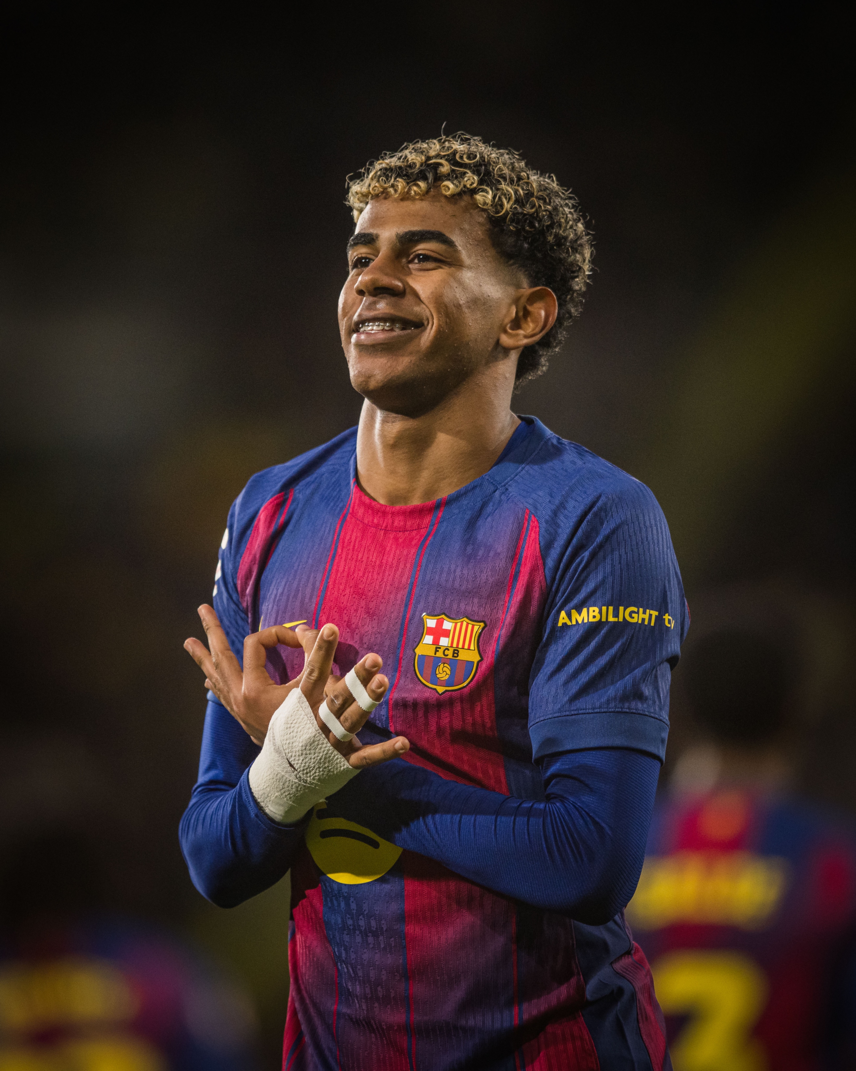 FC Barcelona's Lamine Yamal smiling during a match