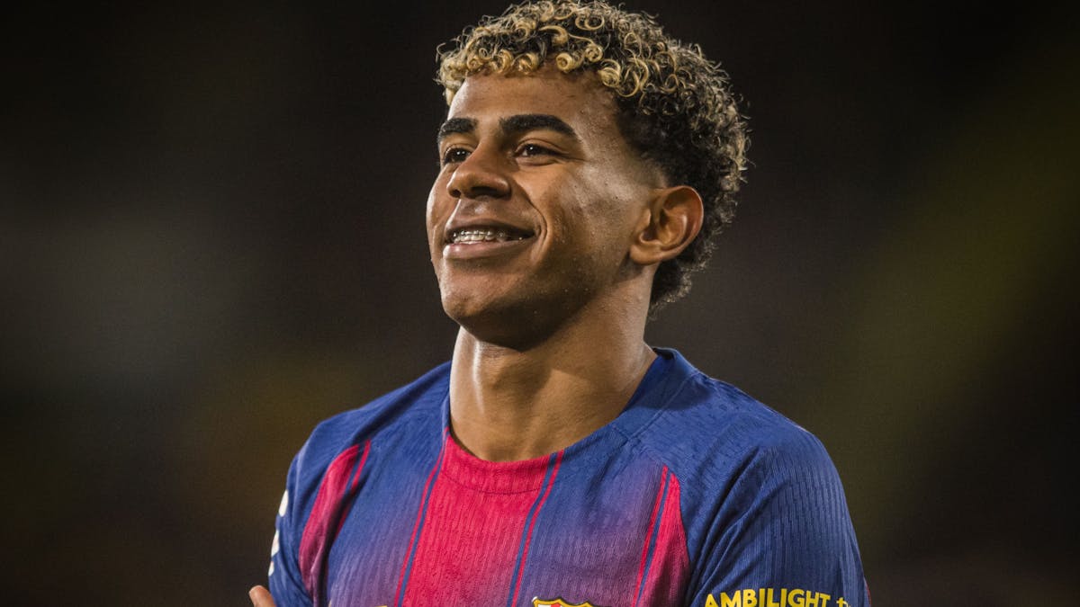 FC Barcelona's Lamine Yamal smiling during a match