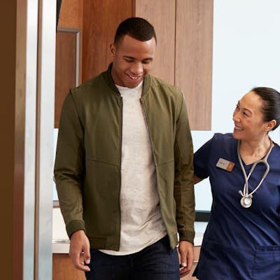 Provider walking a patient out of the clinic